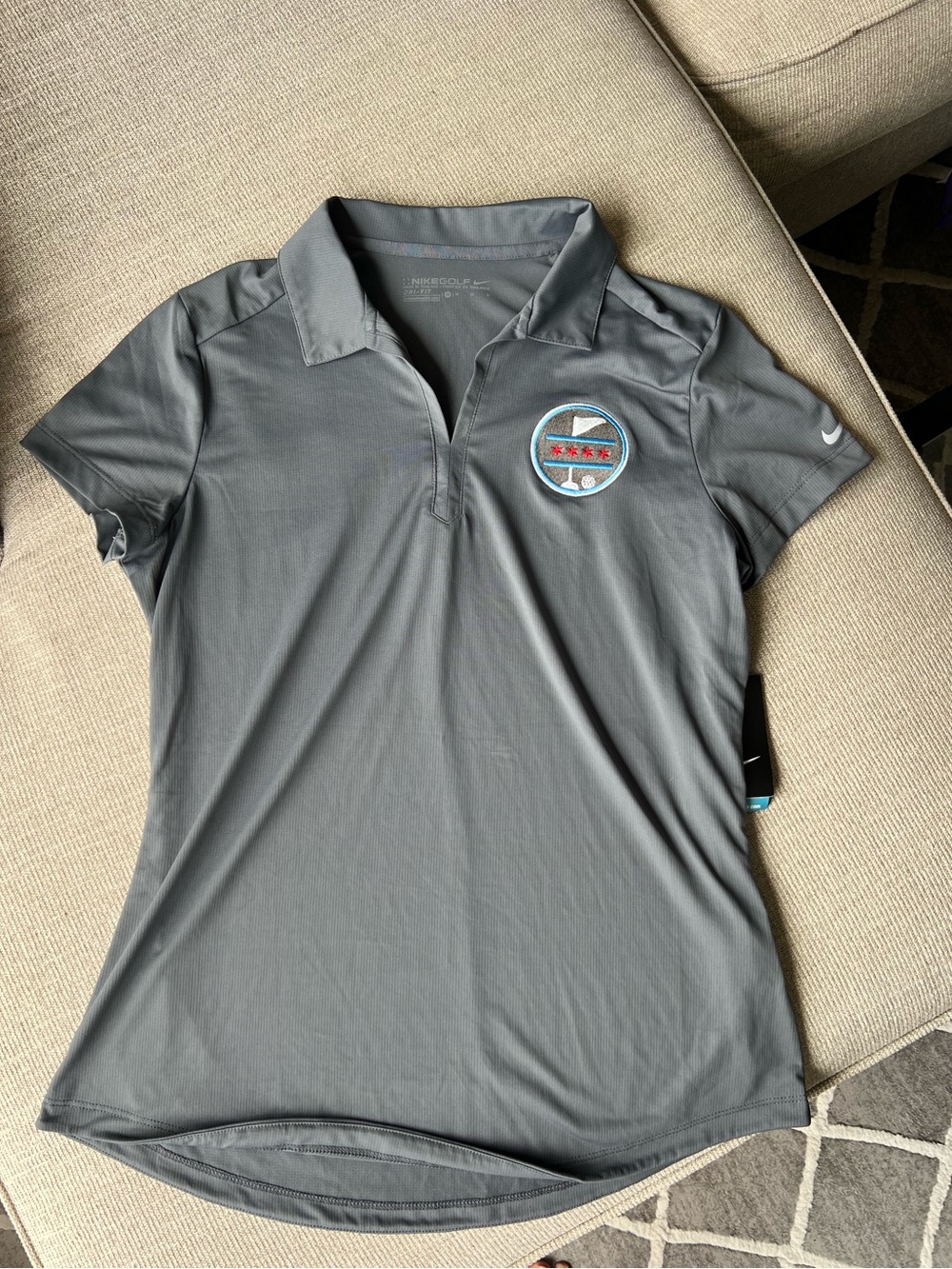 Nike Women's Gray Polo with Embroidered Round Patch